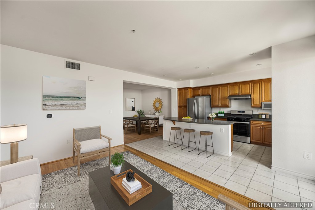 85 East Commonwealth Avenue, Unit 3D Alhambra, CA 91801 - Photo 6 of 30 a living room with furniture a rug and white walls