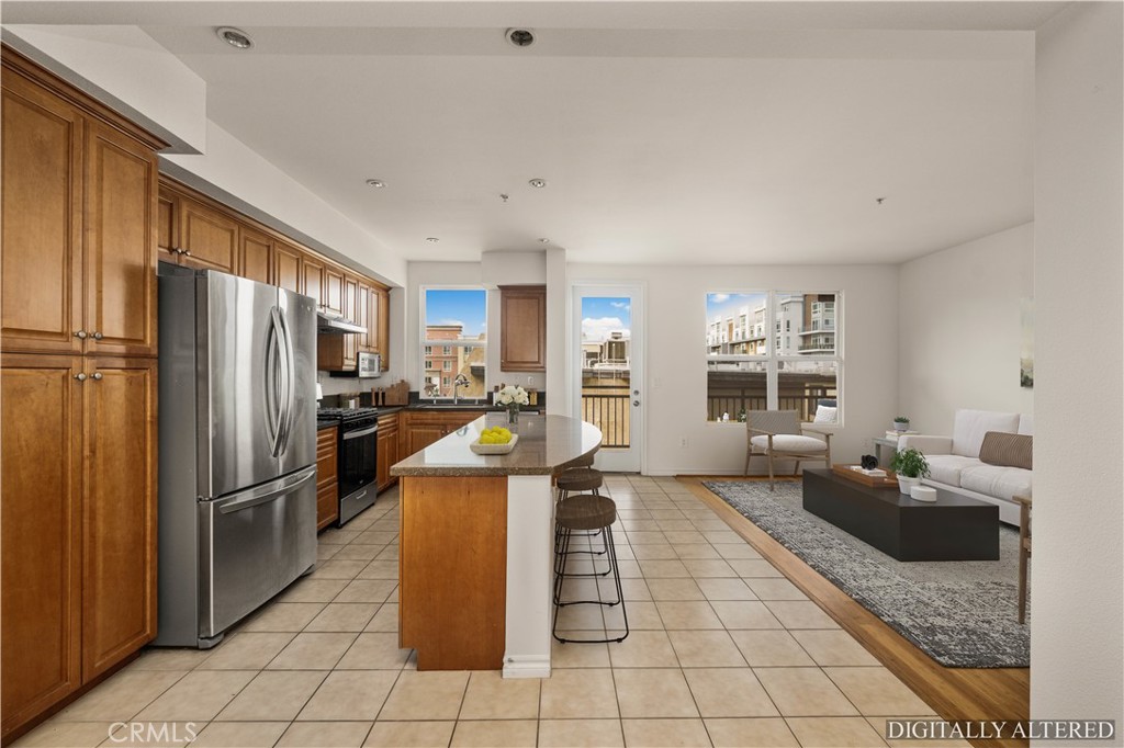 85 East Commonwealth Avenue, Unit 3D Alhambra, CA 91801 - Photo 8 of 30 a kitchen with refrigerator and furniture