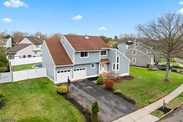 a aerial view of a house with a big yard