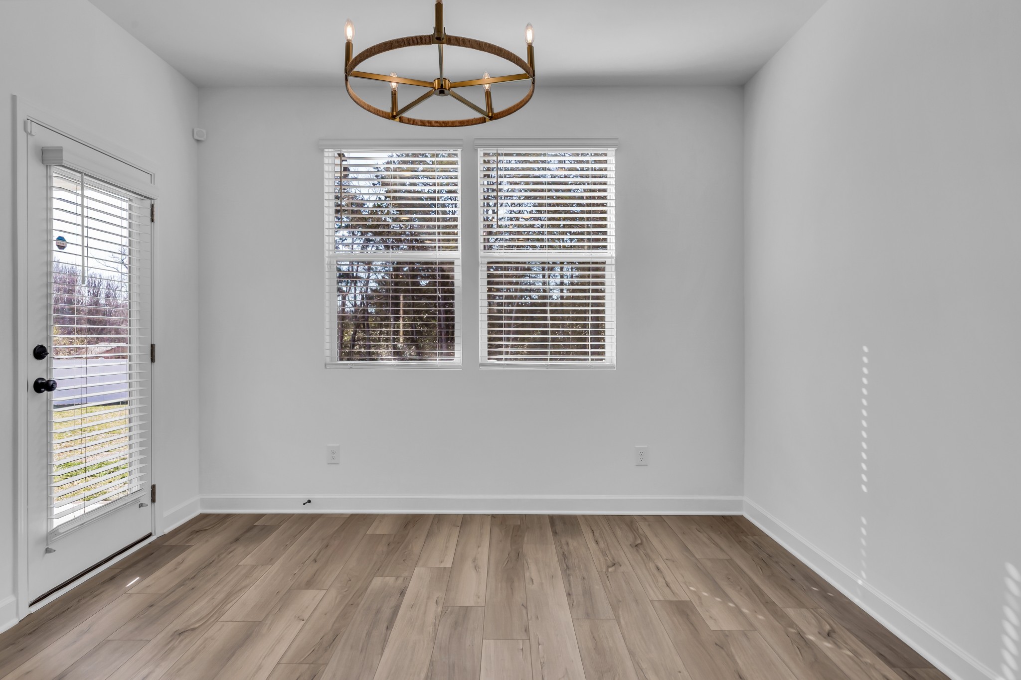 2701 Slatewood Way Murfreesboro, TN 37129 - Photo 14 of 30 an empty room with wooden floor chandelier fan and windows