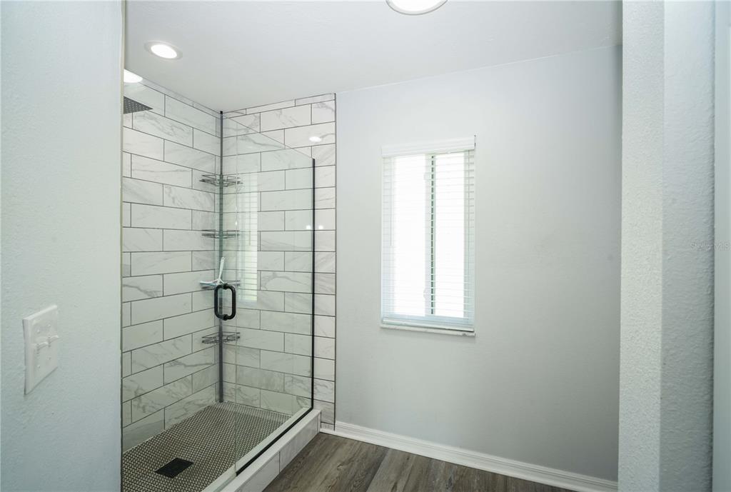 10523 Southwest 62nd Ter Road Ocala, FL 34476 - Photo 16 of 38 a bathroom with a shower