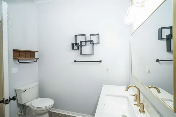 a bathroom with a toilet and sink