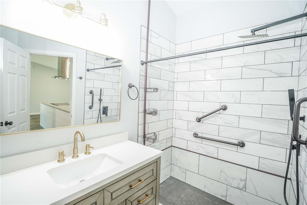 10523 Southwest 62nd Ter Road Ocala, FL 34476 - Photo 21 of 38 a bathroom with a sink shower and a mirror