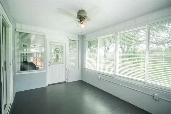 a view of an empty room with a window