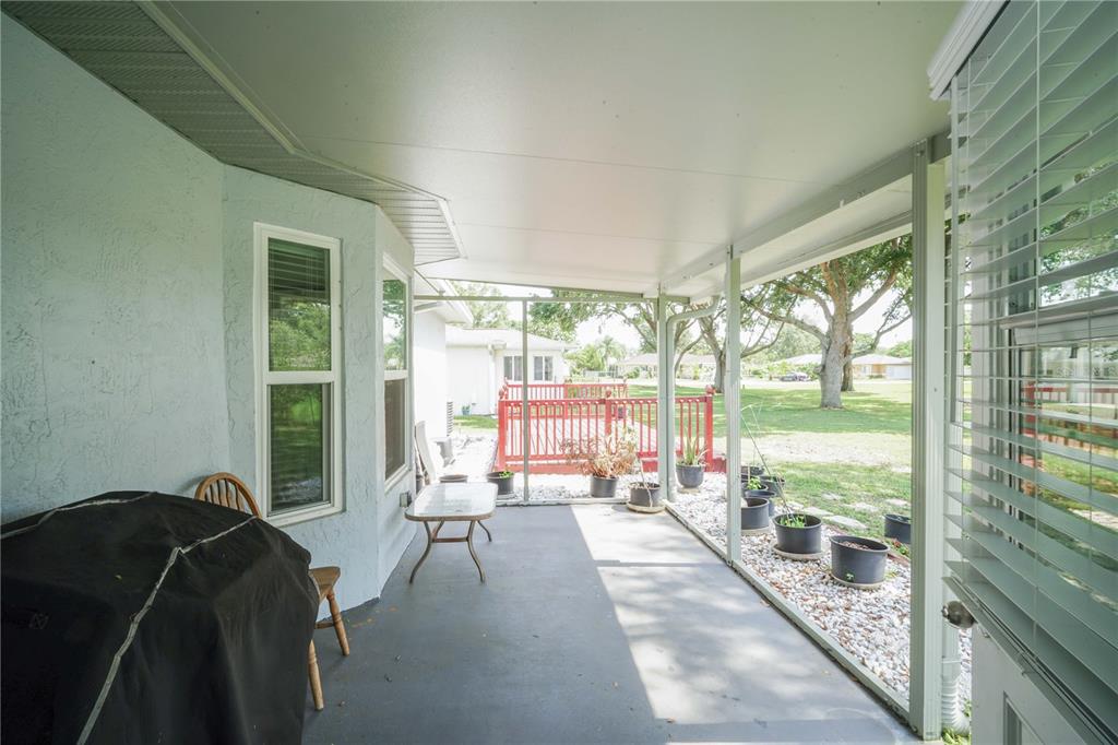 10523 Southwest 62nd Ter Road Ocala, FL 34476 - Photo 26 of 38 a living room with furniture and floor to ceiling windows
