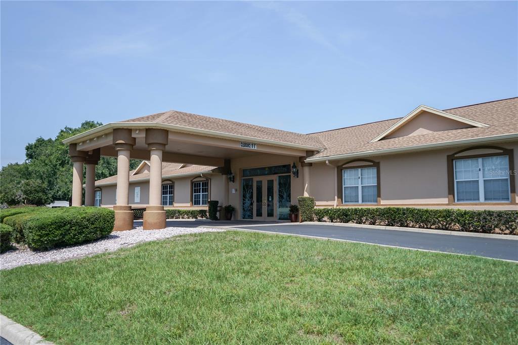 10523 Southwest 62nd Ter Road Ocala, FL 34476 - Photo 31 of 38 a front view of a house with a garden and plants