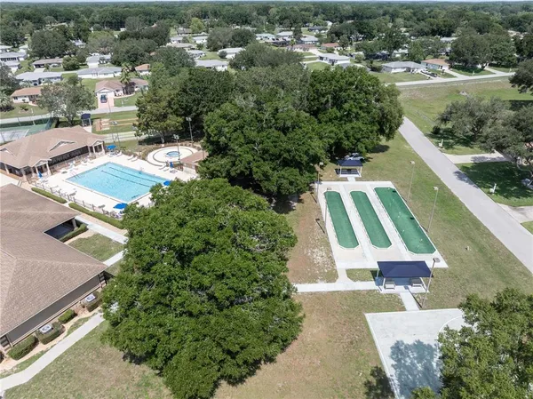 an aerial view of residential house with outdoor space and swimming pool