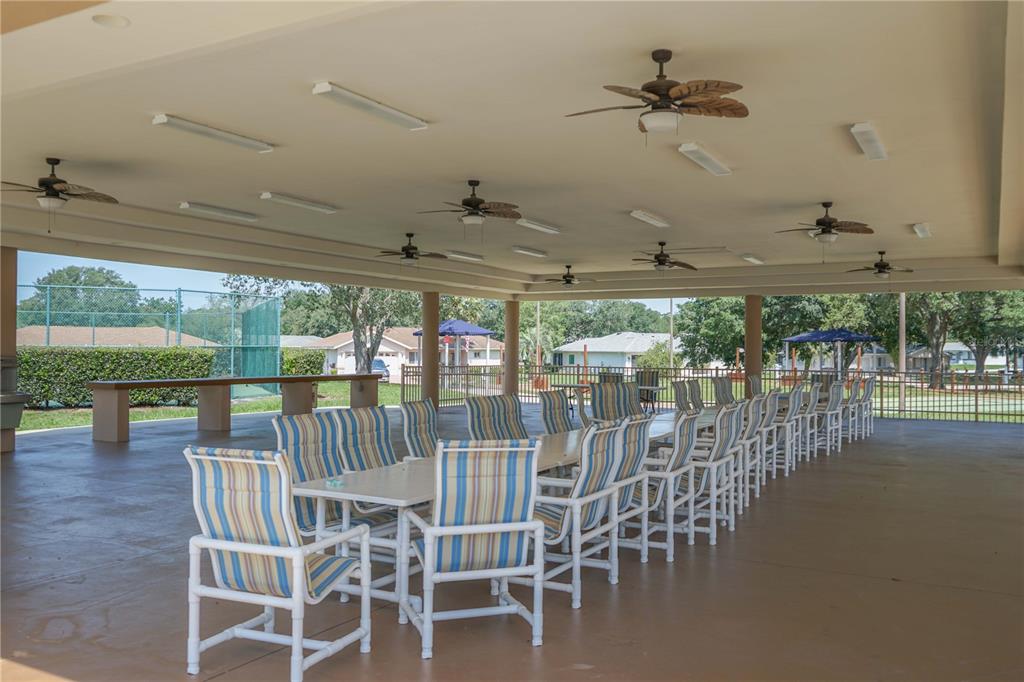 10523 Southwest 62nd Ter Road Ocala, FL 34476 - Photo 34 of 38 a view of a dining room with furniture window and outside view