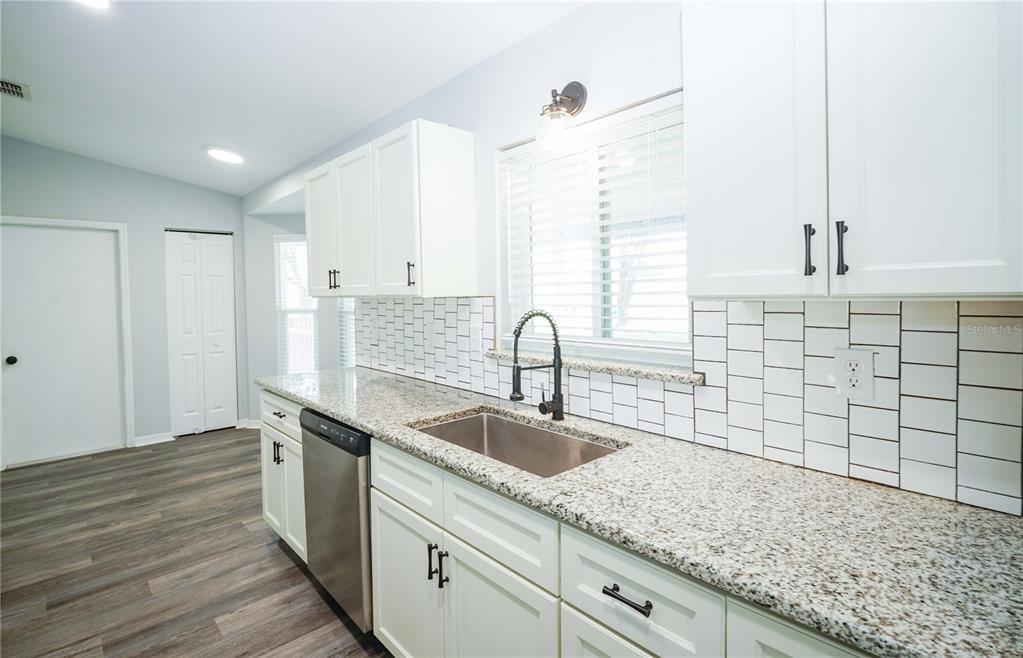 10523 Southwest 62nd Ter Road Ocala, FL 34476 - Photo 9 of 38 a kitchen with a sink and cabinets