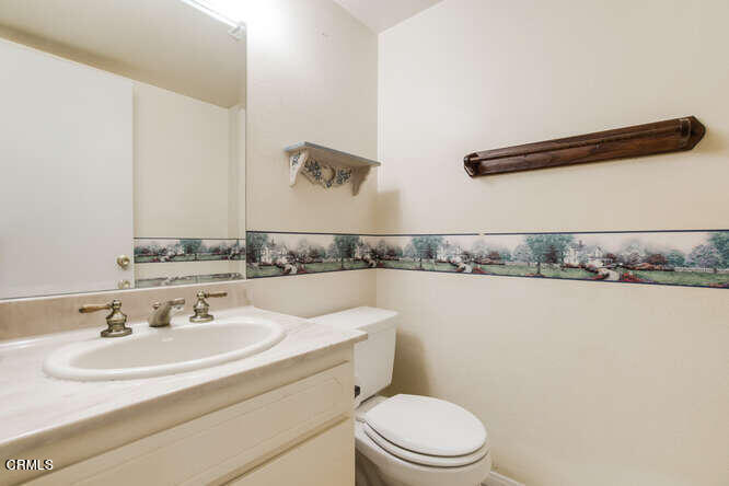 3020 Jacktar Avenue Oxnard, CA 93035 - Photo 12 of 31 a bathroom with a granite countertop sink and a toilet