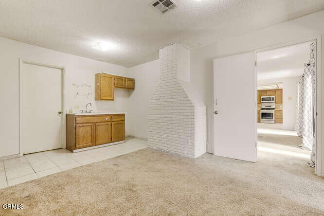 3020 Jacktar Avenue Oxnard, CA 93035 - Photo 13 of 31 a view of a storage & utility room with wooden floor