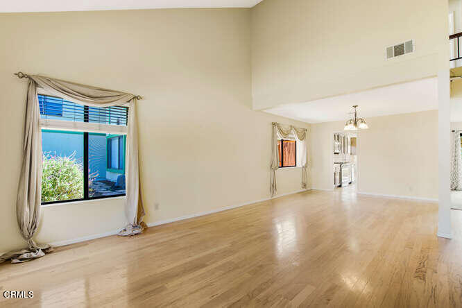 3020 Jacktar Avenue Oxnard, CA 93035 - Photo 2 of 31 a view of a big room with wooden floor and windows