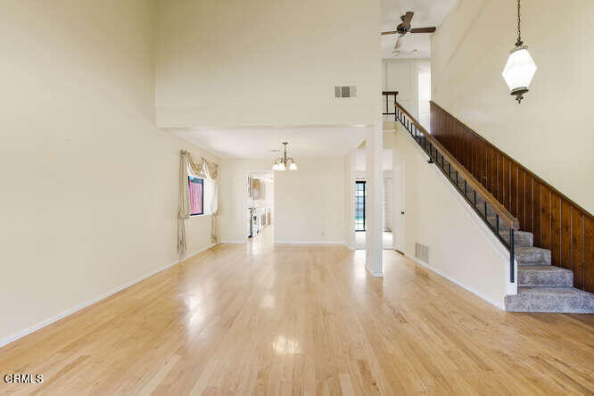 3020 Jacktar Avenue Oxnard, CA 93035 - Photo 3 of 31 a view of a hallway with wooden floor and staircase