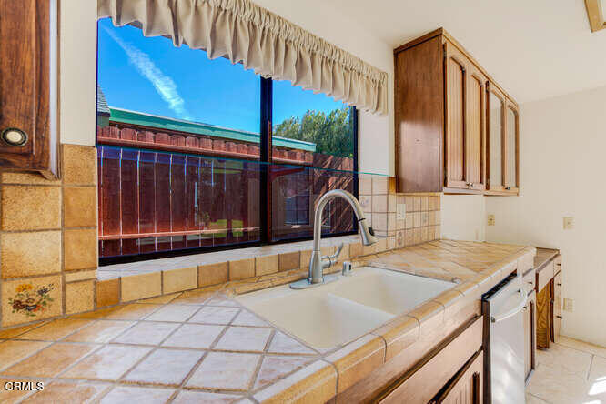 3020 Jacktar Avenue Oxnard, CA 93035 - Photo 10 of 31 a bathroom with a sink and a mirror