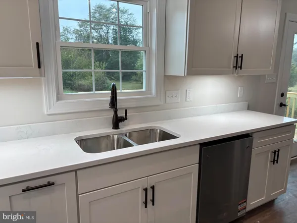 a kitchen with a sink and cabinets