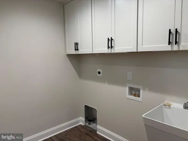 a view of cabinets and wooden floor