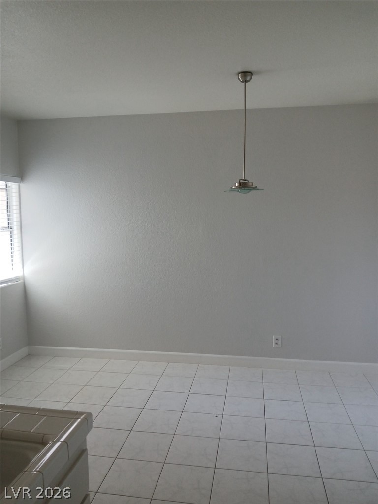 2201 Ramsgate Drive, Unit 426 Henderson, NV 89074 - Photo 12 of 22 Bright and airy room featuring durable tile flooring and natural light.