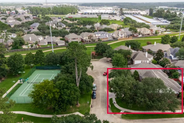 a view of front door of house and covered with trees
