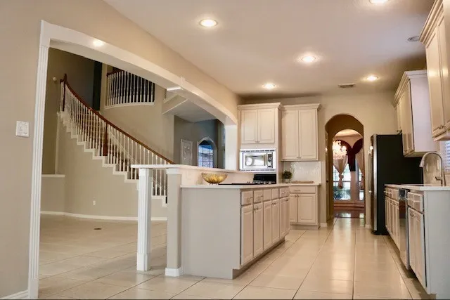 a kitchen with sink and cabinets