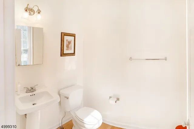 a bathroom with a granite countertop sink and a large mirror