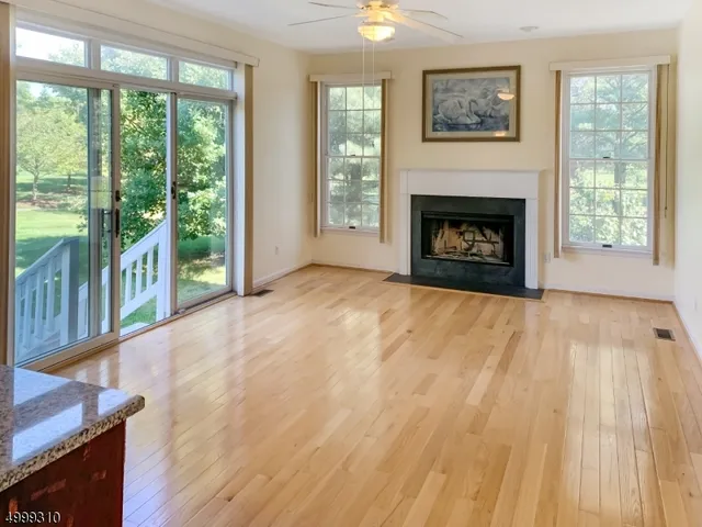a view of staircase with railing and a window