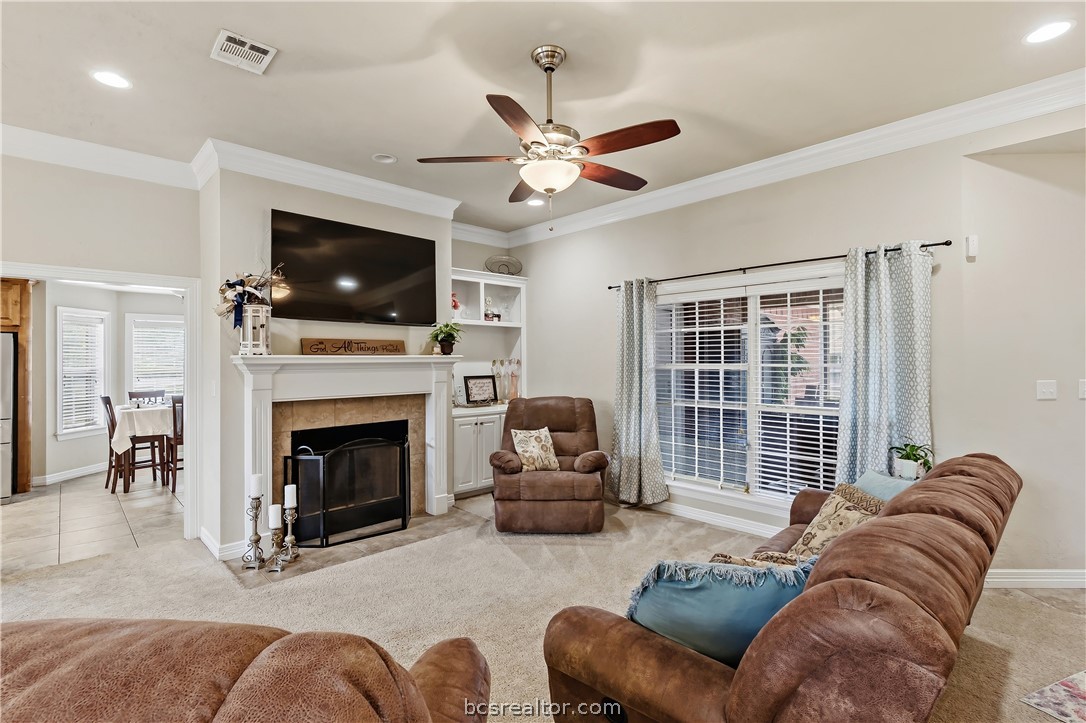 2700 Hickory Court Bryan, TX 77808 - Photo 4 of 31 Living room with built in shelving, gas fireplace & mantle