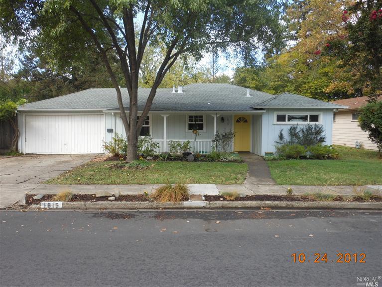 1815 Terrace Way Santa Rosa, CA 95404 - Photo 1 of 1 a house with a garden and large trees