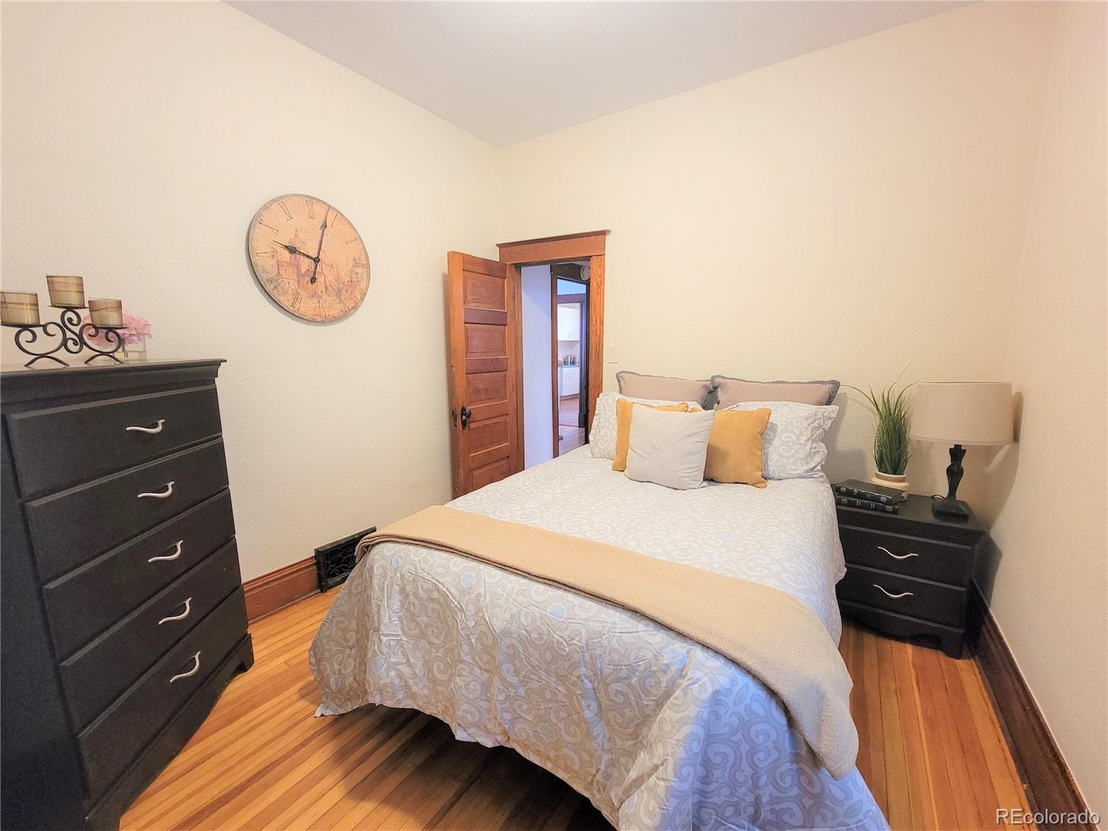 2835 Decatur Street Denver, CO 80211 - Photo 21 of 32 a bedroom with a bed and a closet