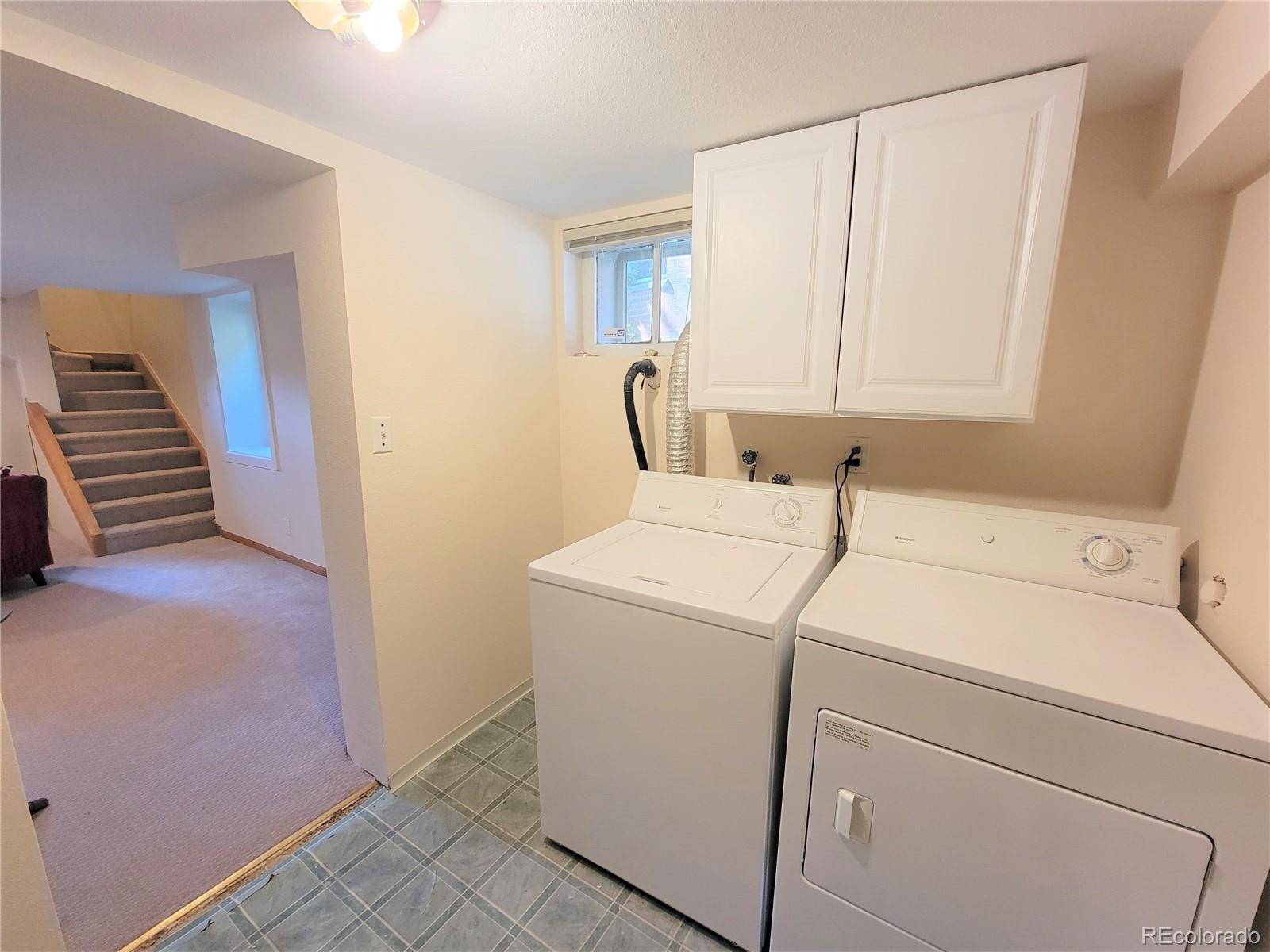 2835 Decatur Street Denver, CO 80211 - Photo 27 of 32 a view of storage and utility room with washer and dryer