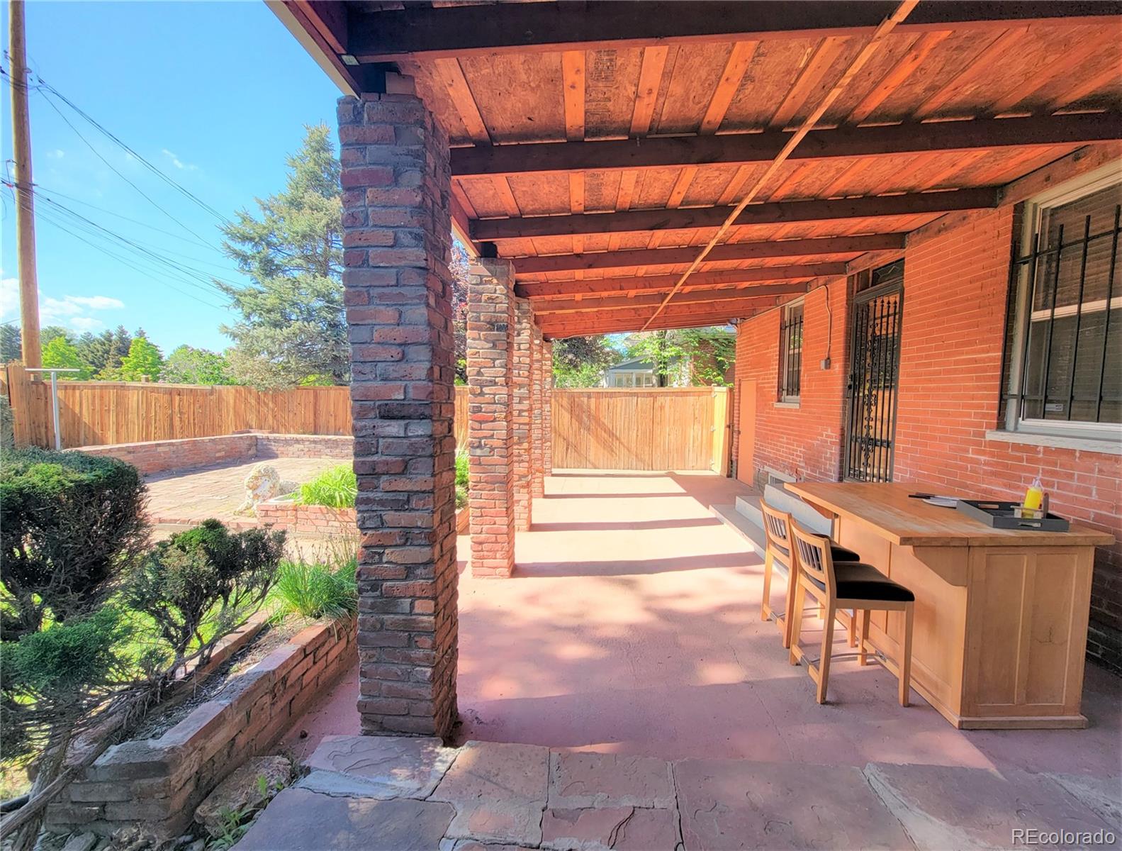2835 Decatur Street Denver, CO 80211 - Photo 30 of 32 a backyard of a house with outdoor seating