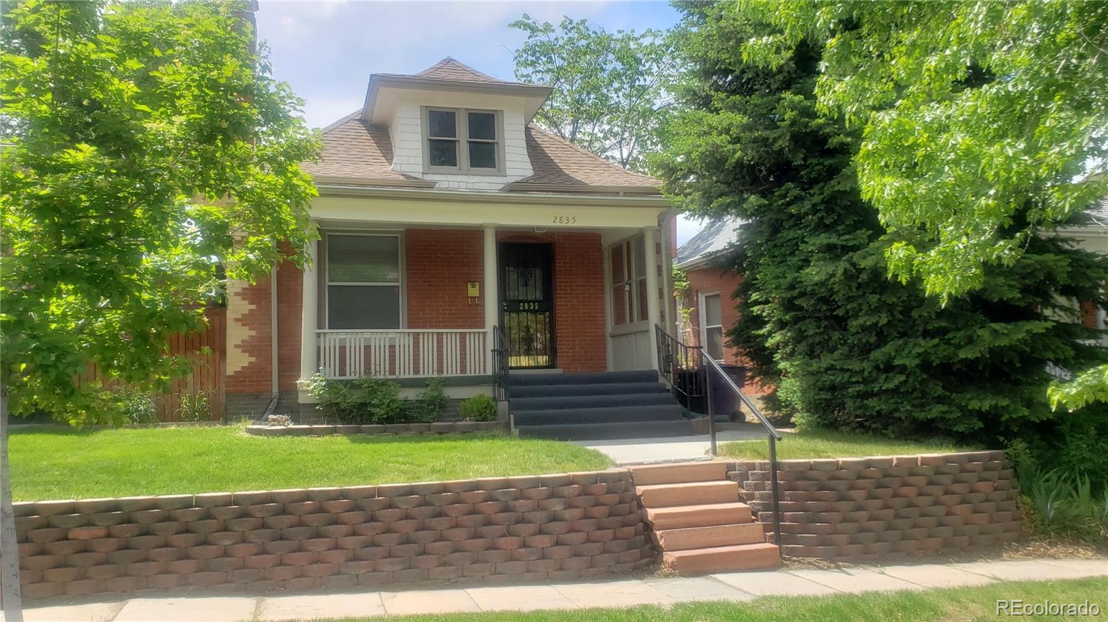 2835 Decatur Street Denver, CO 80211 - Photo 3 of 32 a view of a house with a yard