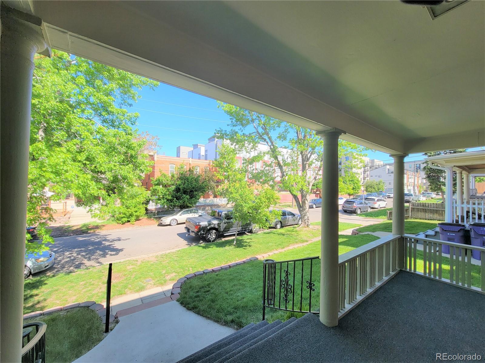 2835 Decatur Street Denver, CO 80211 - Photo 5 of 32 a view of a porch with furniture and garden