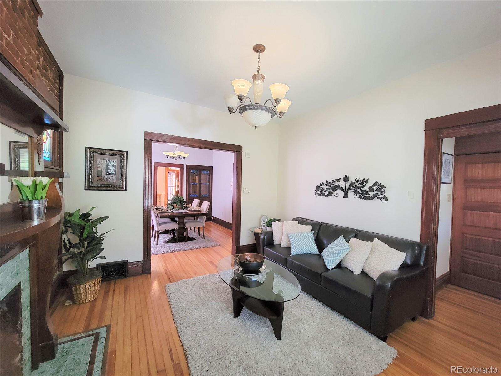 2835 Decatur Street Denver, CO 80211 - Photo 7 of 32 a living room with furniture and wooden floor