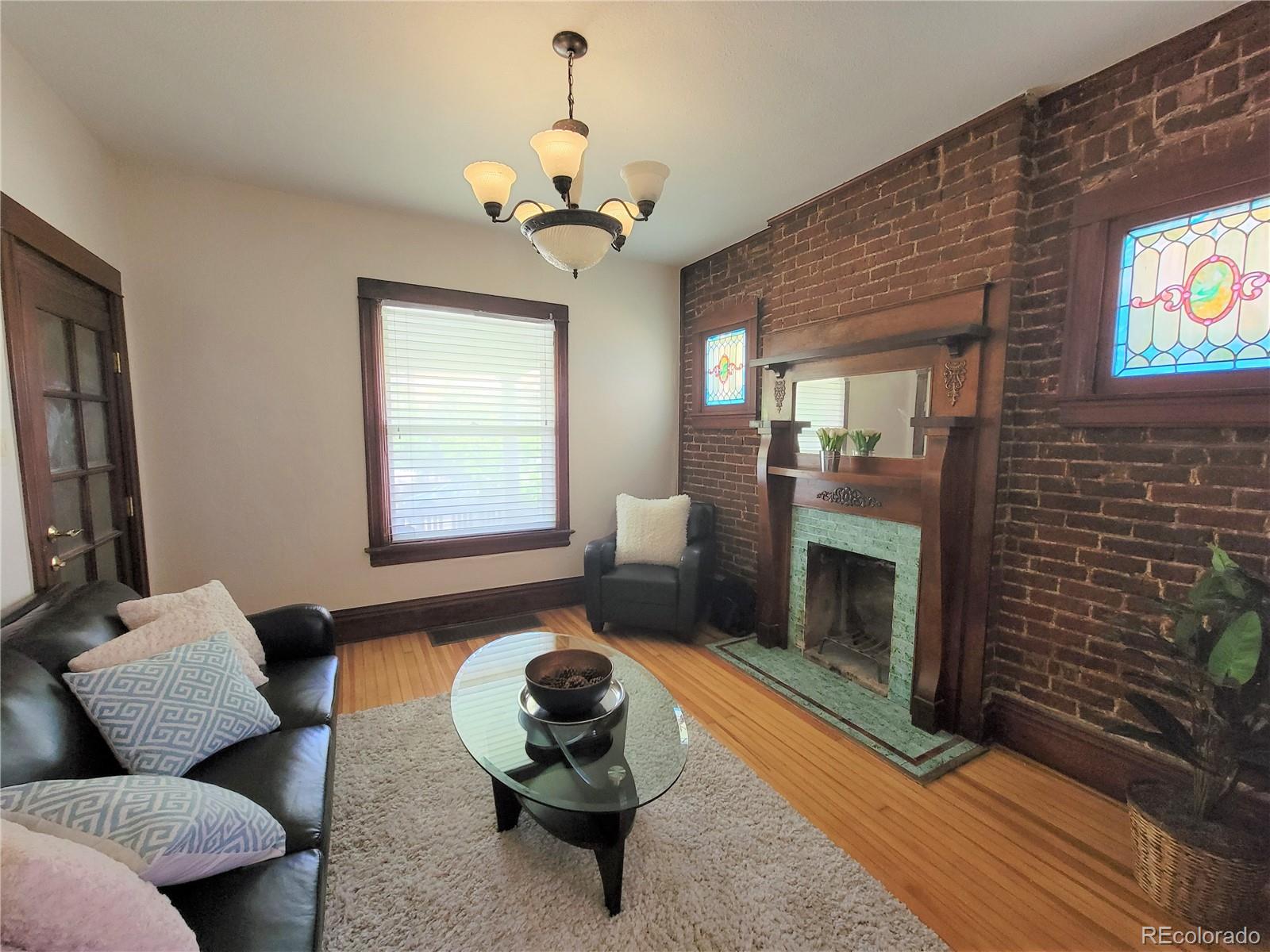 2835 Decatur Street Denver, CO 80211 - Photo 8 of 32 a living room with furniture and a fireplace