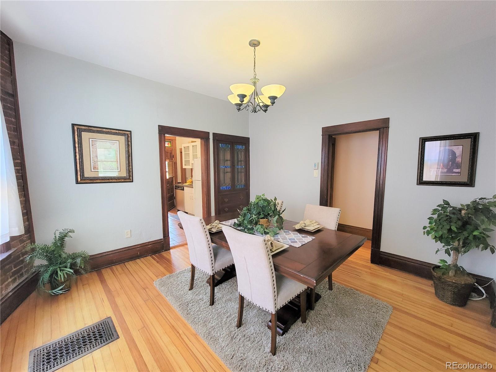 2835 Decatur Street Denver, CO 80211 - Photo 10 of 32 a workspace with wooden floor and a potted plant