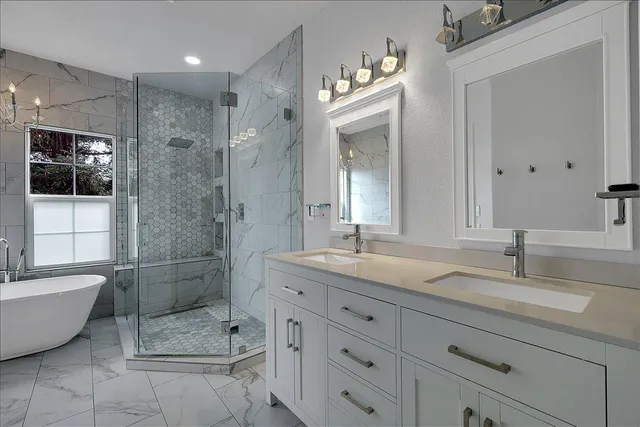 a bathroom with a bathtub and shower