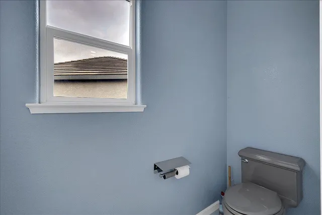 a bathroom with a double vanity sink mirror and shower
