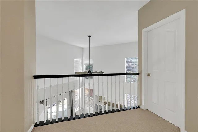 a view of a hallway with staircase