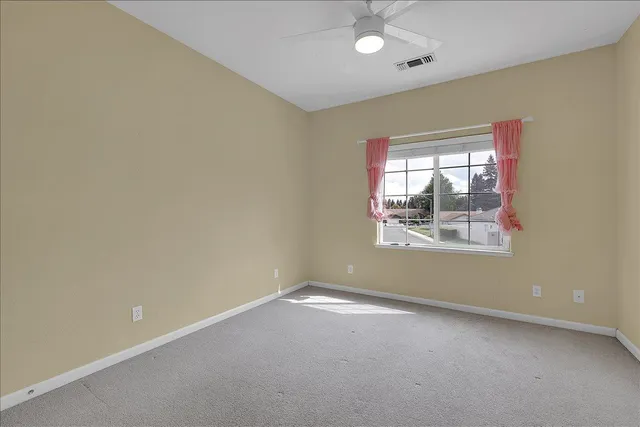 wooden floor and window in an empty room