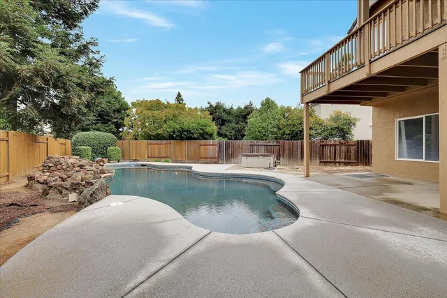 a view of a backyard of the house