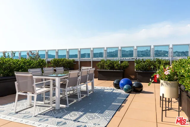 a view of a chairs and table on the terrace