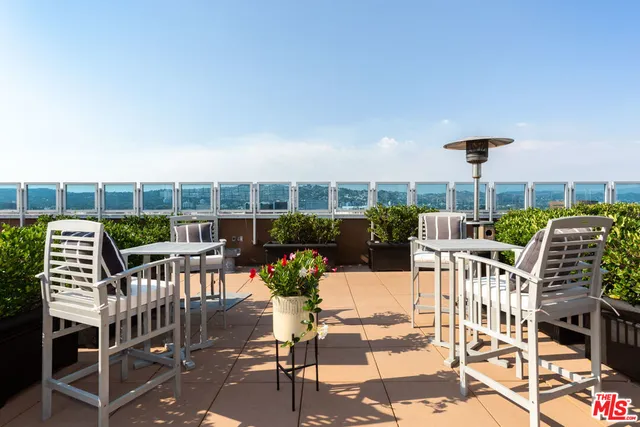 a view of a chairs and table in a patio