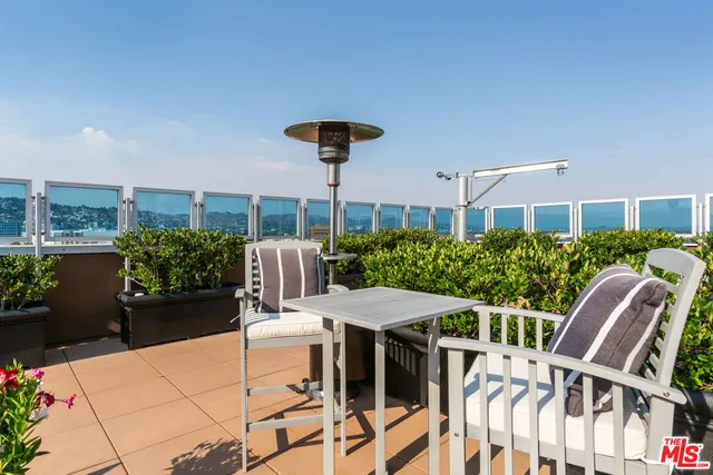 a outdoor living space with furniture and garden view