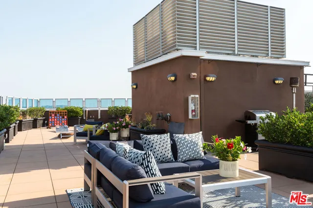 a outdoor space with tables and chairs