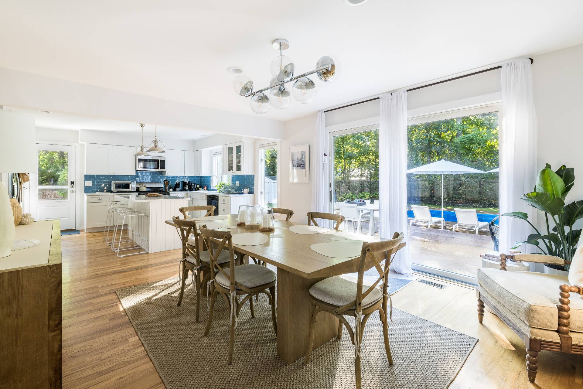 4594 Noyack Road Sag Harbor, NY 11963 - Photo 13 of 31 a view of a dining room with furniture window and outside view