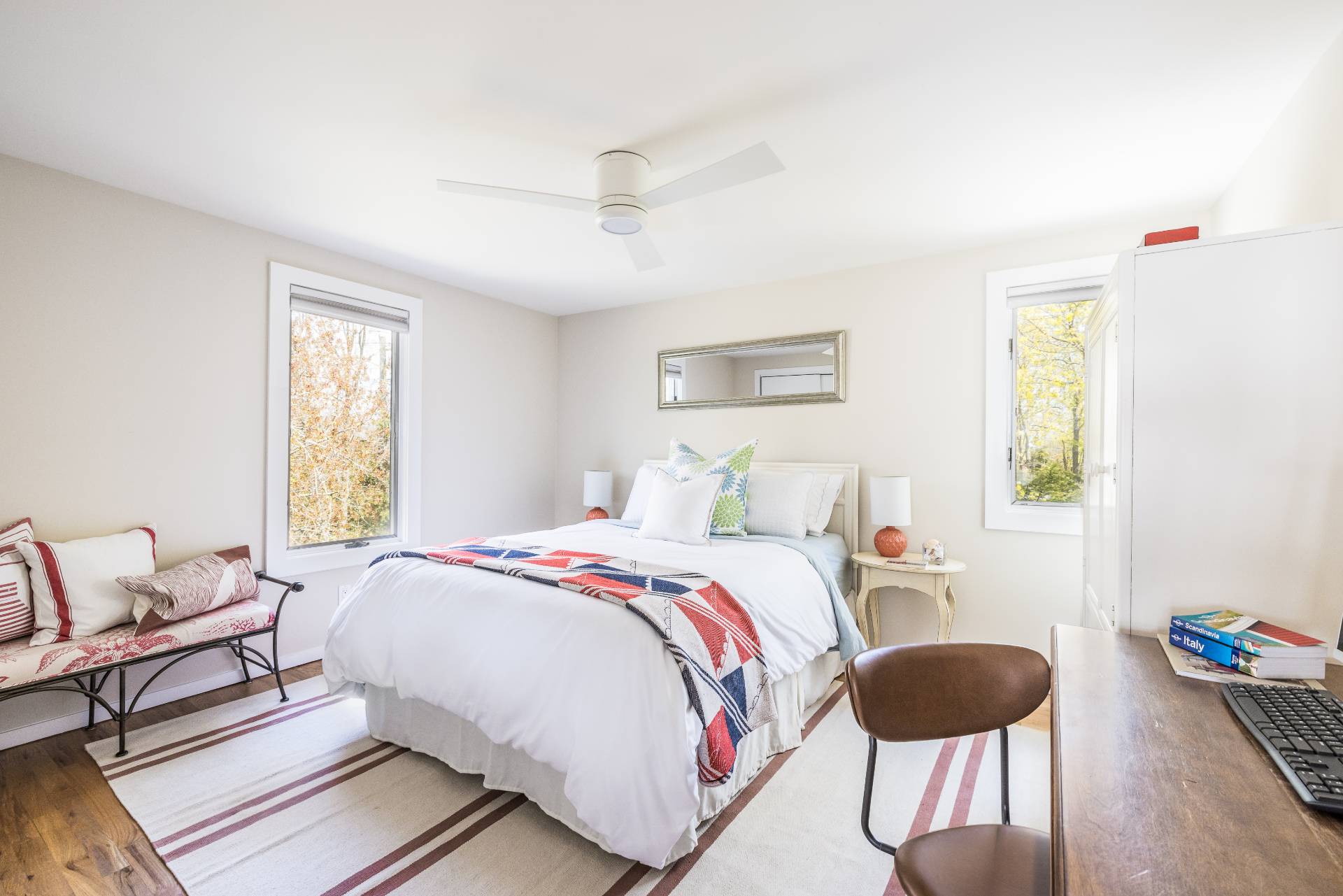 4594 Noyack Road Sag Harbor, NY 11963 - Photo 18 of 31 a bedroom with a bed and wooden floor