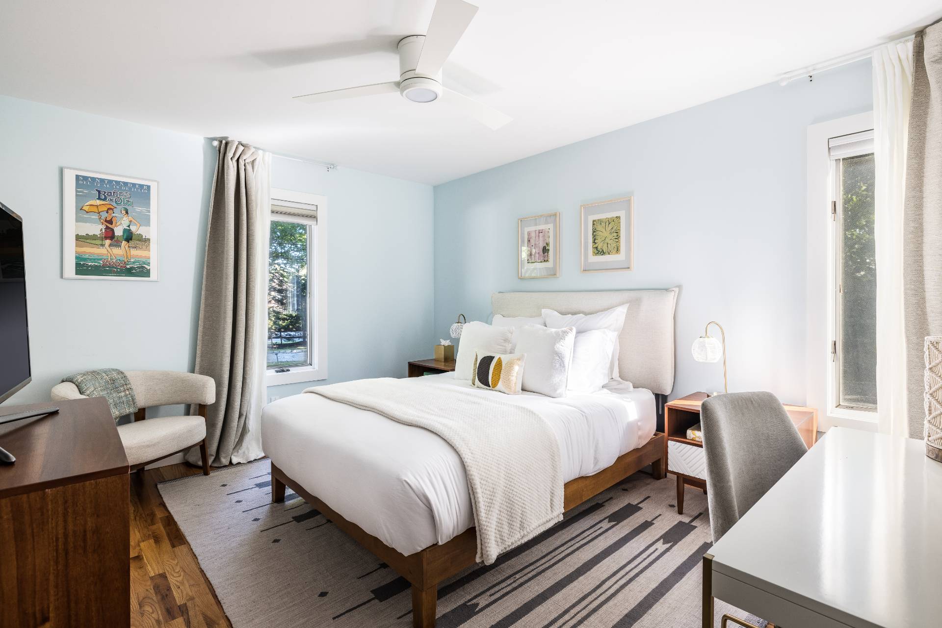 4594 Noyack Road Sag Harbor, NY 11963 - Photo 19 of 31 a bedroom with a bed and wooden floor