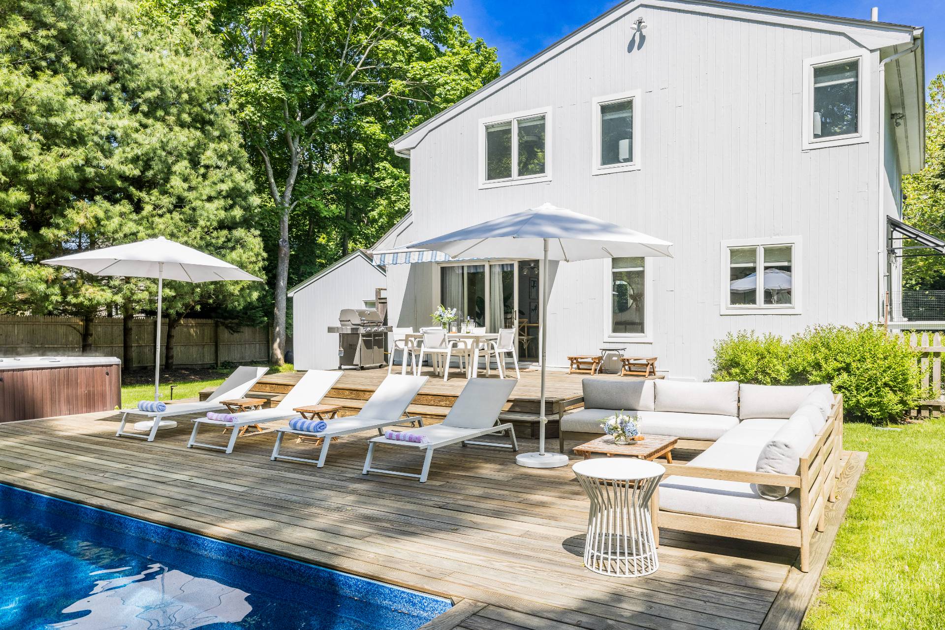 4594 Noyack Road Sag Harbor, NY 11963 - Photo 2 of 31 a view of a patio with chairs and a table