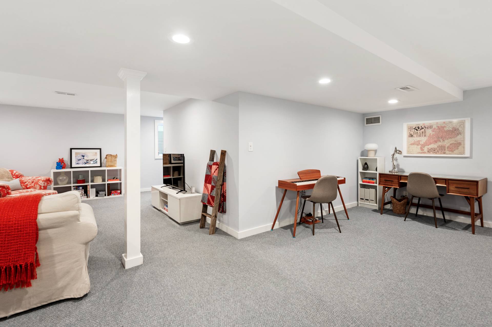 4594 Noyack Road Sag Harbor, NY 11963 - Photo 24 of 31 a living room with furniture and a flat screen tv