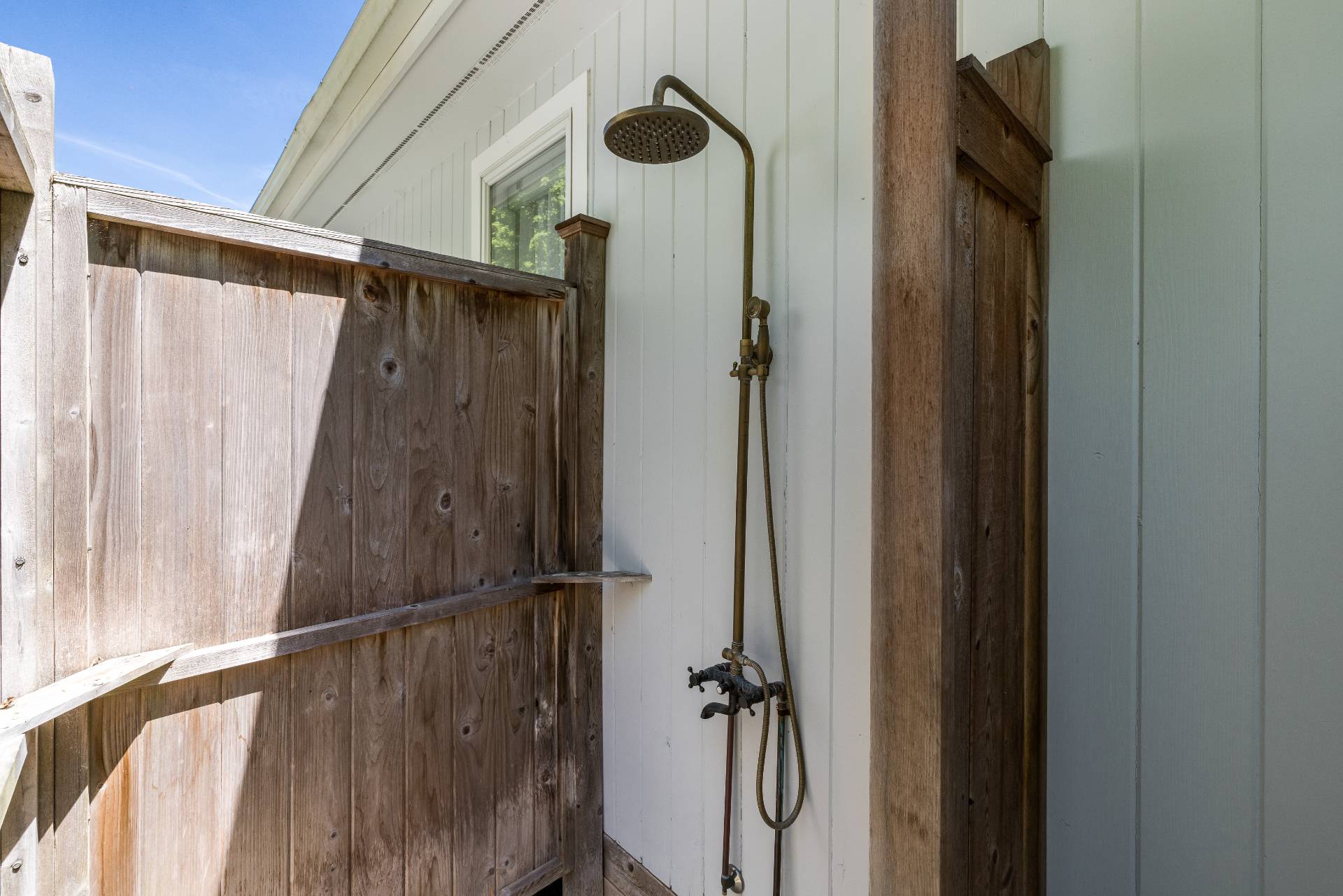 4594 Noyack Road Sag Harbor, NY 11963 - Photo 25 of 31 a bathroom with a shower and a mirror